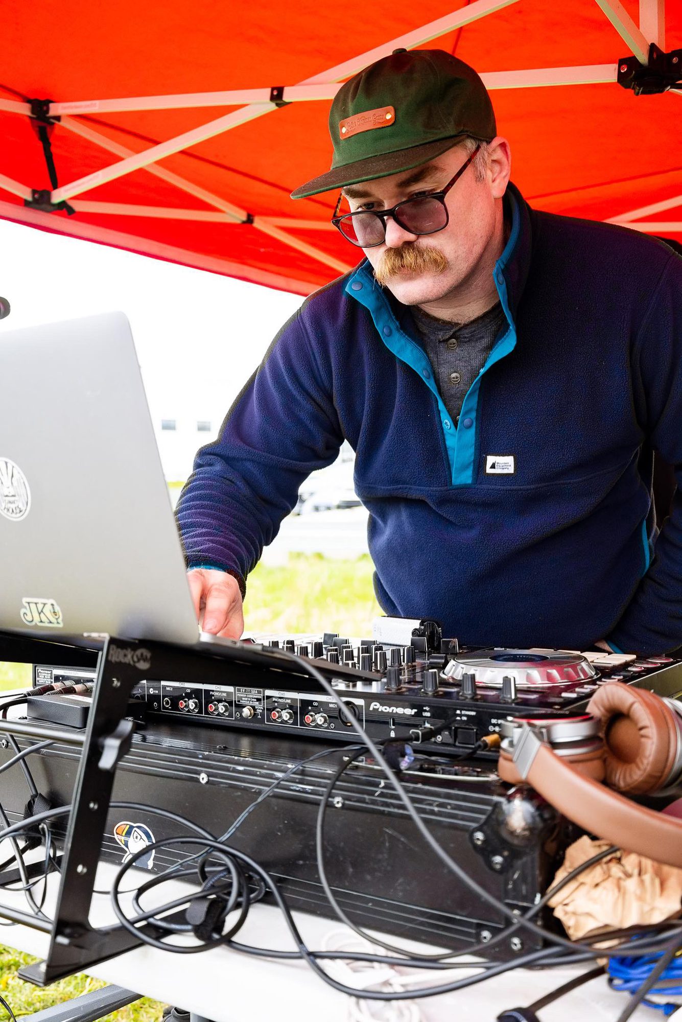 DJ smiling behind the decks
