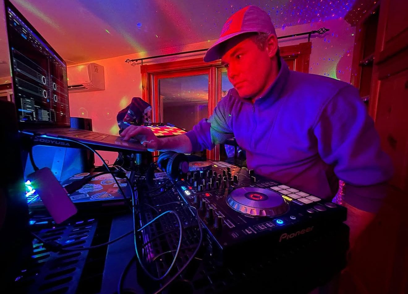 DJ at outdoor event under tent